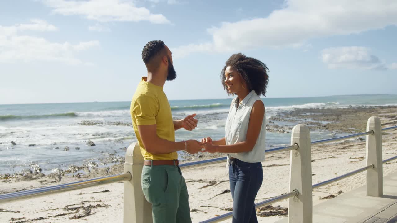 Couple interacting with each other at beach 4k