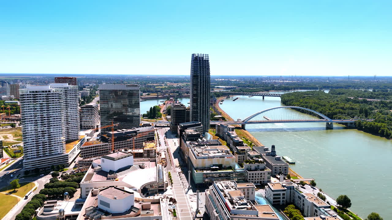 View on the beautiful Danube River crossed by two bridges. Panorama of stunning Bratislava, Slovakia from aerial perspective.