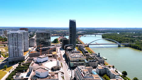 view on the beautiful danube river crossed by two bridges. panorama of stunning bratislava, slovakia from aerial perspective.