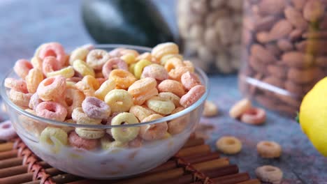 colorful cereal with milk and other breakfast foods