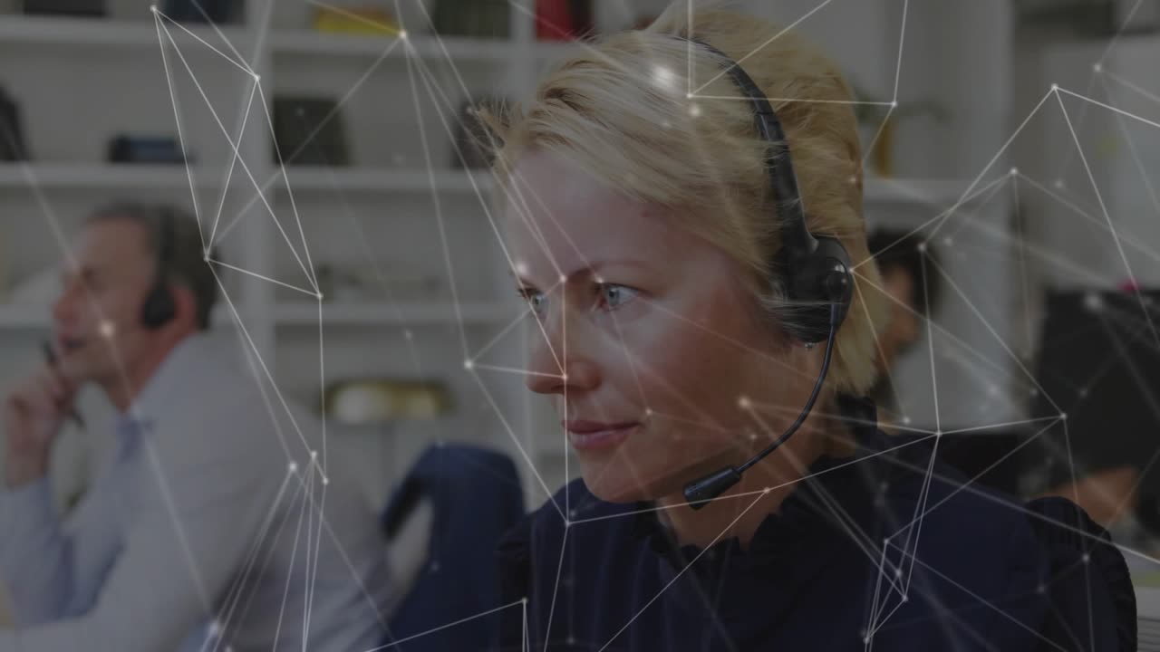 Tech support agent wearing headset answering call while network overlay mapping flows animating