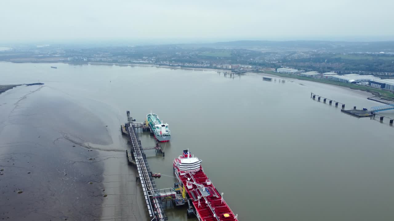 Aerial view of cargo ships docked on a river