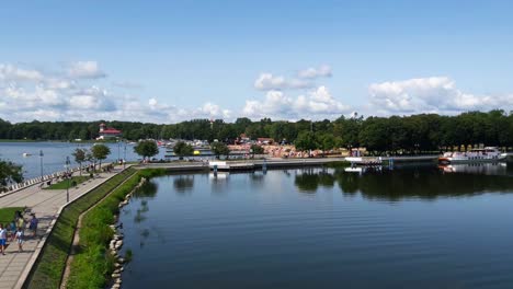 people walking in between two lakes in poland, gizycko