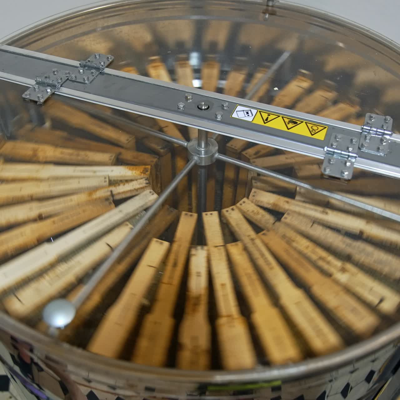 Switching on the honey extracting machine. Starting the process of harvesting healthy product. Top view