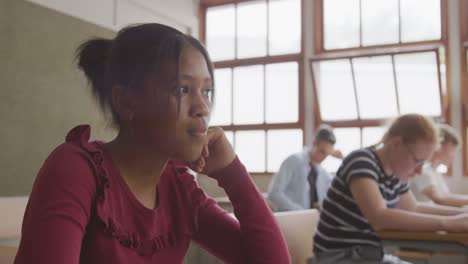 African-american-girl-writing-in-class