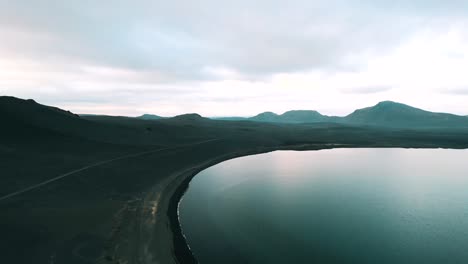 Beautiful-Landscape-In-Iceland-Over-A-Glassy-Lake,-Aerial-View
