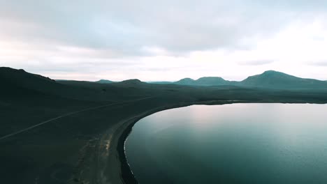 beautiful landscape in iceland over a glassy lake, aerial view