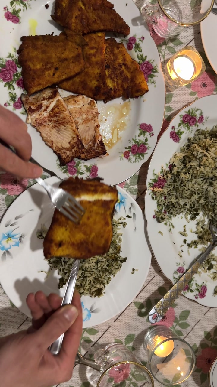 Fried fish cooking marinade seasoning herbs spices to serve crispy golden crunchy Persian Nowruz dinner meal on table family gathering homemade tartar sauce seafood gourmet tasty healthy comfort food