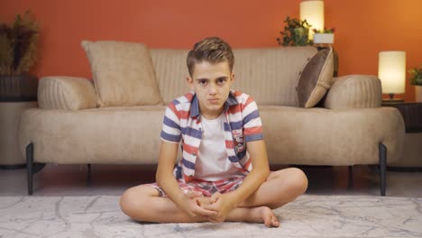 boy looking negative at camera congratulates.