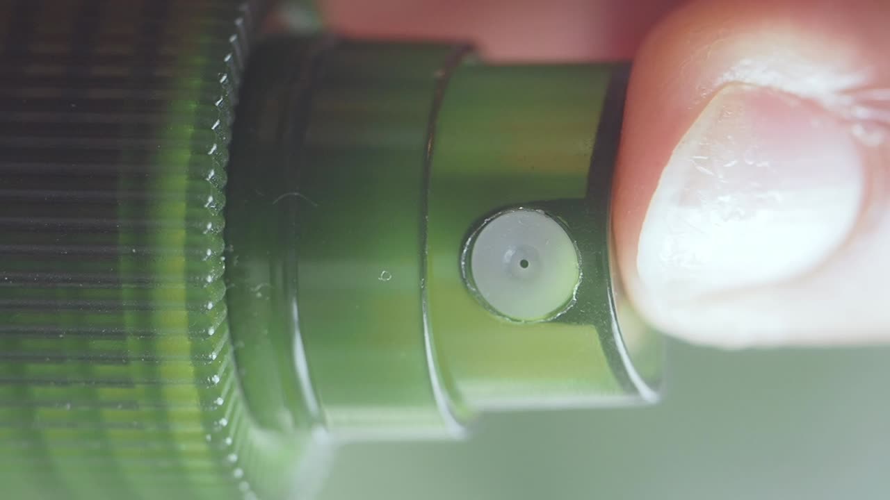 Close-up of a Green Spray Bottle Nozzle