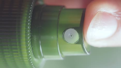 close-up of a green spray bottle nozzle