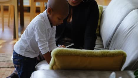 Mother-and-son-having-fun-on-sofa-in-a-comfortable-home-4k