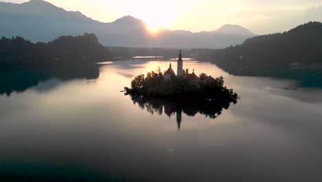 a beautiful reflection of lake bled at sunrise