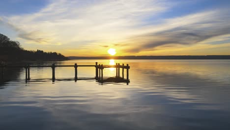 drone flight over lake ammersee near munich at sunset