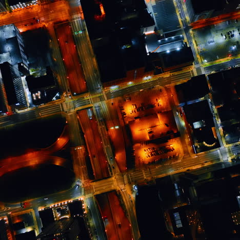 highlighted streets of philadelphia streets and roads with white and orange light. top view on the city districts at night.