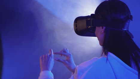 Modern-Female-Using-A-Vr-Headset-On-A-Colorful-Neon-Light-Background