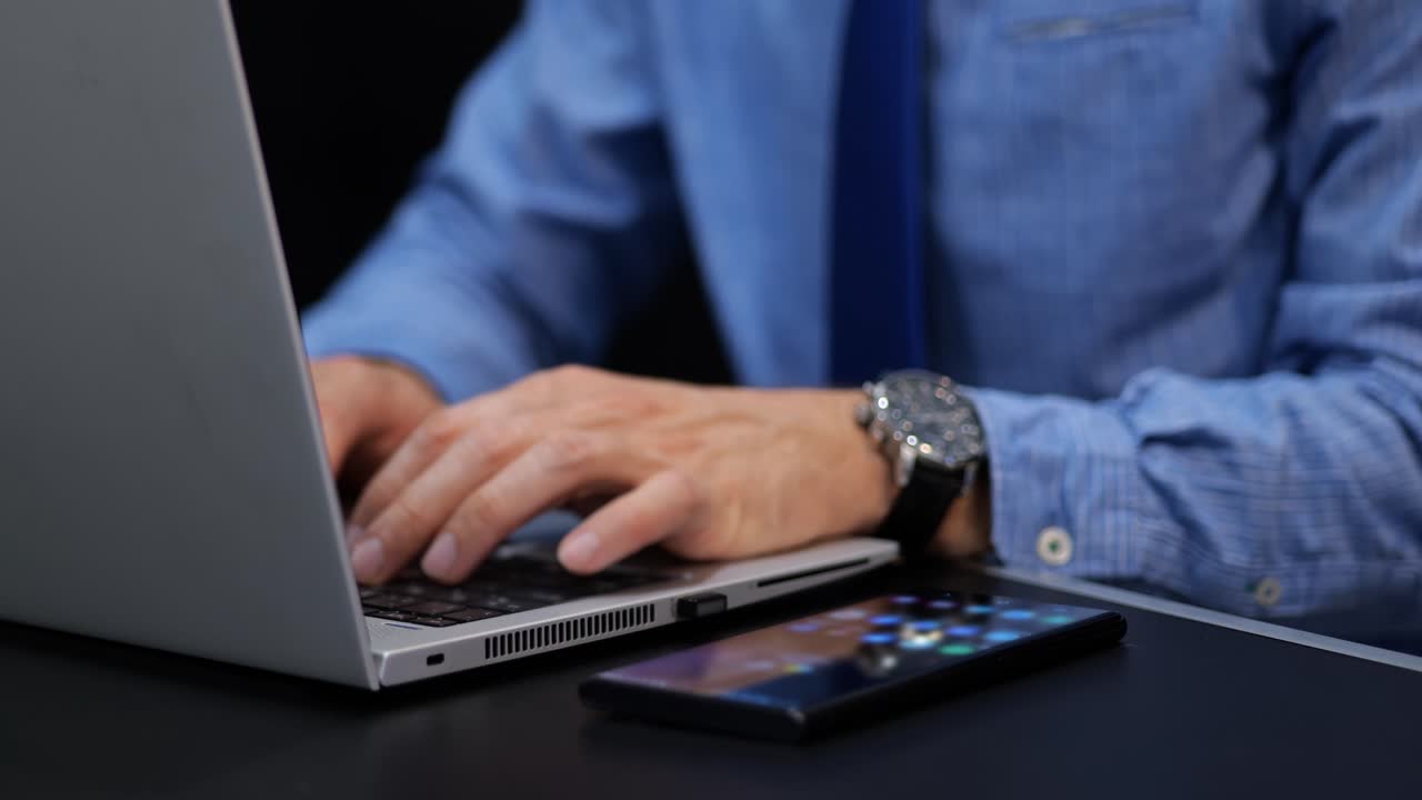 Man typing his password and verification to a two steps authentication on laptop