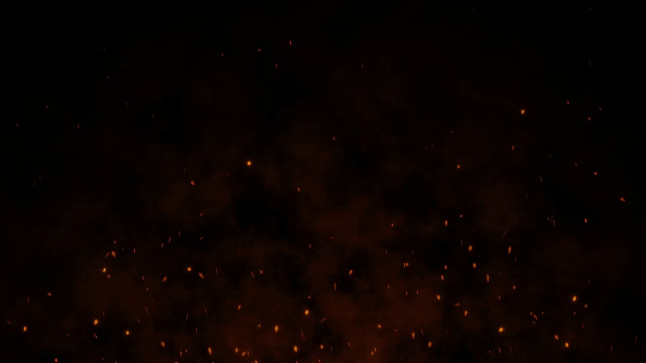 Shot of flying fire sparks in the air on dark black background. 4k