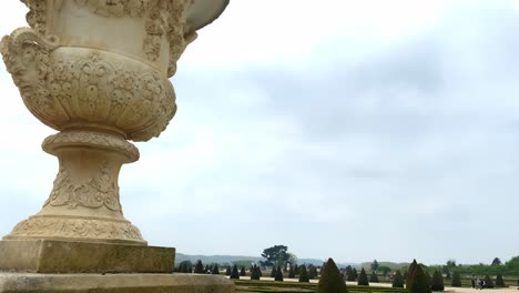 beautiful gardens of versailles palace in france - pan down shot