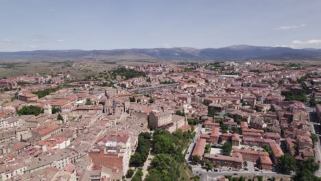 tranquil drone view across medieval city center to mountains