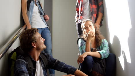 Friends-interacting-on-staircase