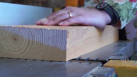 Slow motion view of wood carving in carpentry workshop