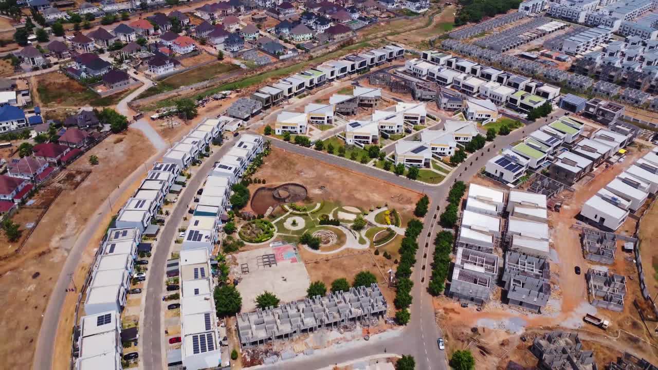 Beautiful aerial of white homes with photovoltaic solar panels on the rooftops in Abuja, Nigeria