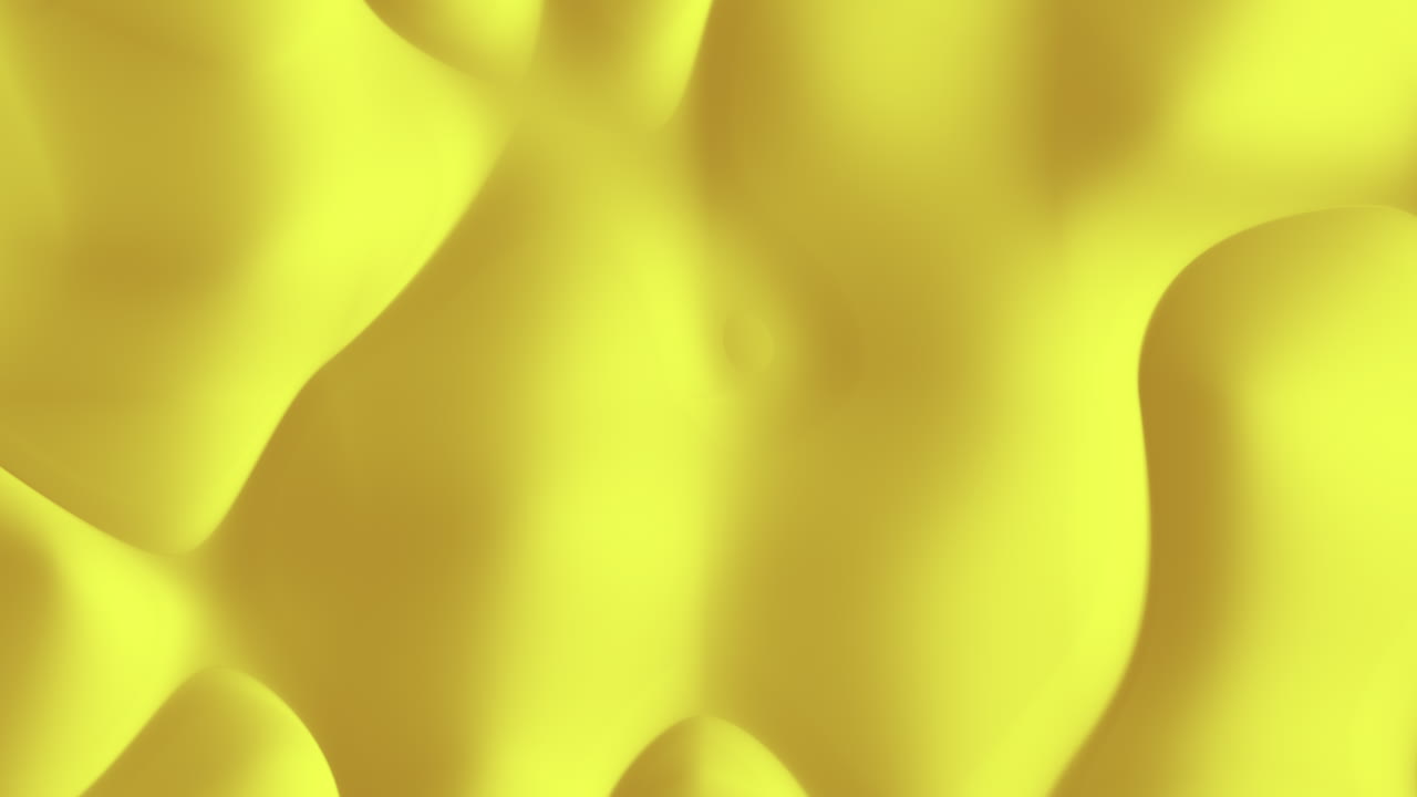 Abstracte gele vloeistofoppervlakte achtergrond met zachte golven en vloeiende gradiënten.