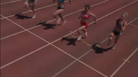 a group of women race on a track