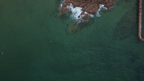 aerial top-down forward over rocky coast of saint-malo in brittany, france