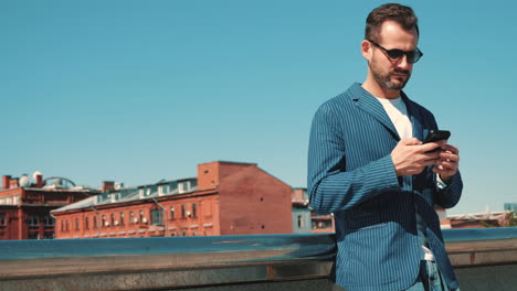 man talking on phone in cityscape