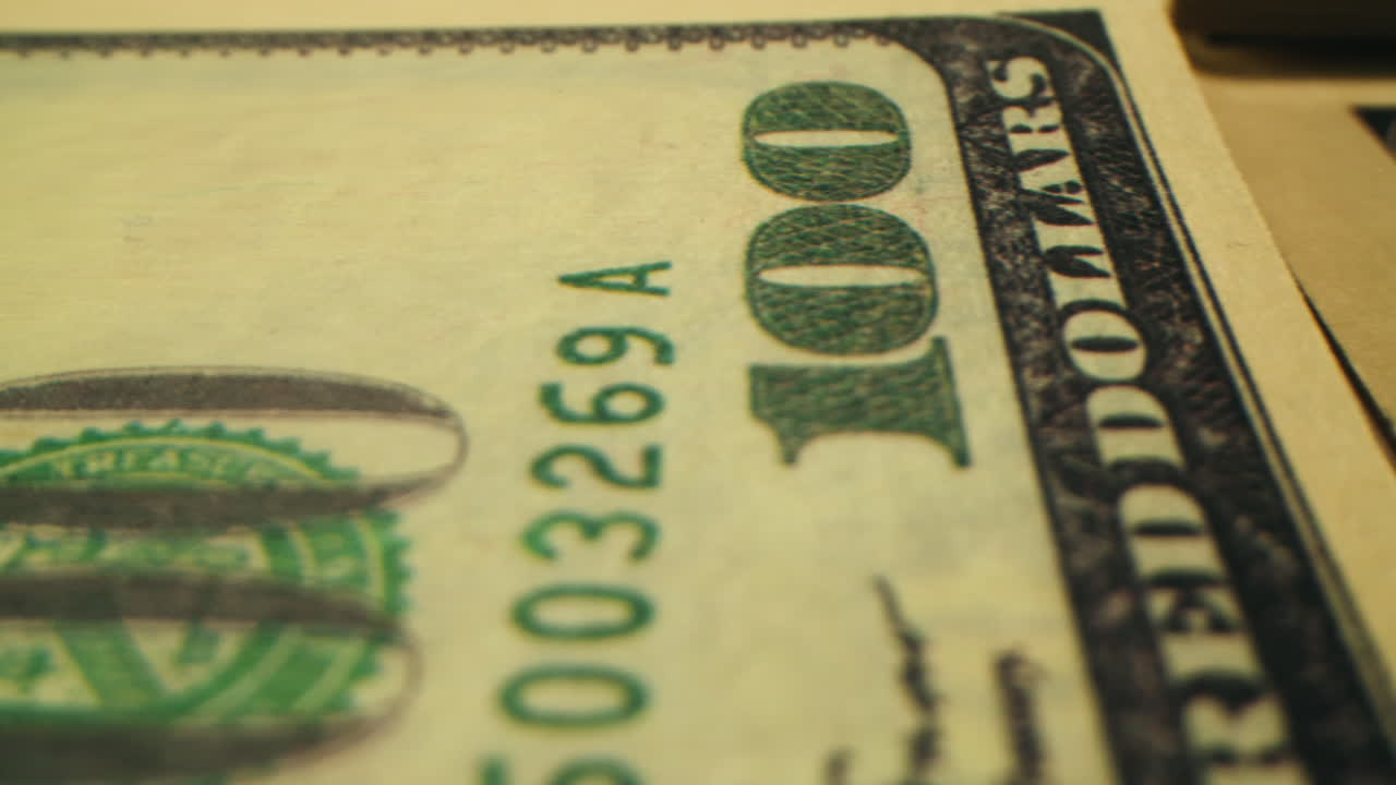 Specialised police officer Counting dollar banknotes in crime lab, conceptual image. High quality 4k footage