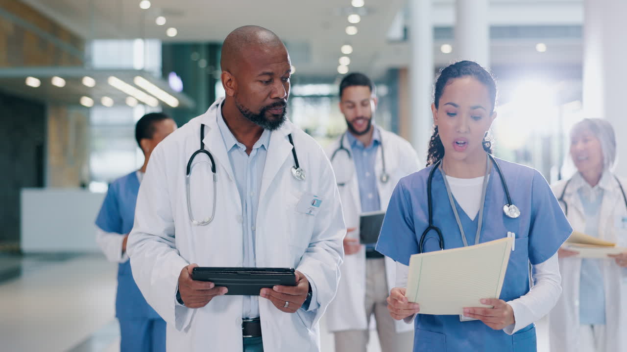 Talking, doctor and nurse with tablet in hospital