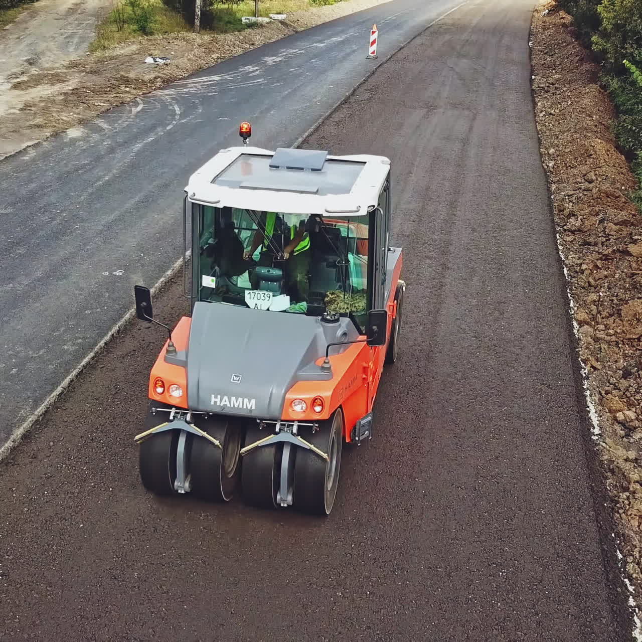 Modern heavy asphalt roller that stack and press hot asphalt. Repairing in modern city with vibration roller compactor