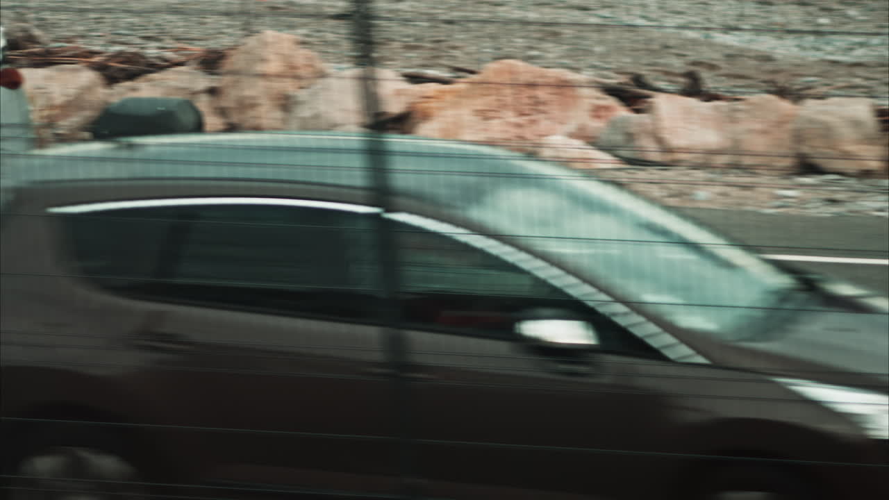 Nice, France - November 24, 2024: View from a moving train of cars moving on the streets of the city