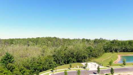 Flying-out-over-a-quiet-suburban-neighborhood-to-reveal-lush-woods