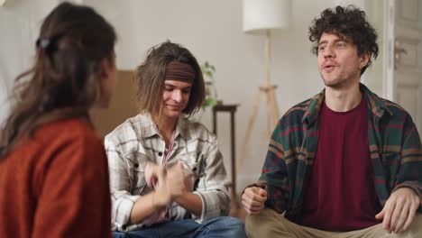 group of friends having a conversation in a living room.