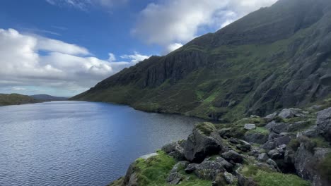 Comeragh-Mountains-Waterford-Ireland-Coumshingaun-Lake-with-high-cliffs-and-rocky-outcrops-at-the-lakeside-in-early-winter-morning