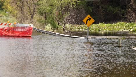 flooded-bridge-turn-sign,-wide-shot