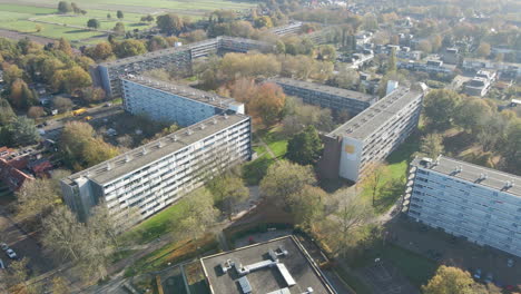 Jib-down-of-social-housing-flats-with-green-parks-in-autumn