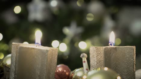 llama de cuatro velas en una corona de adviento en nochebuena grabada con una sony a7 iii en 4k 30fps