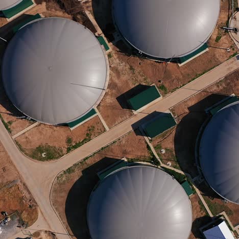 bio gas station plant. ecological energy production factory. aerial view on the biogas station in the green farmland