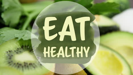 animation of eat healthy text over kiwi fruit