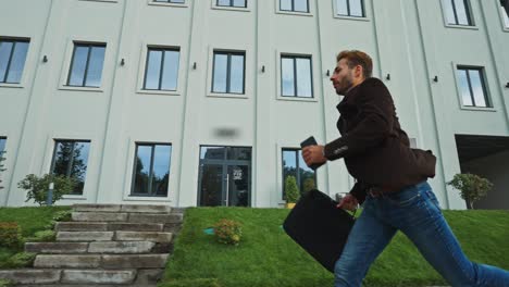 businessman running to office building