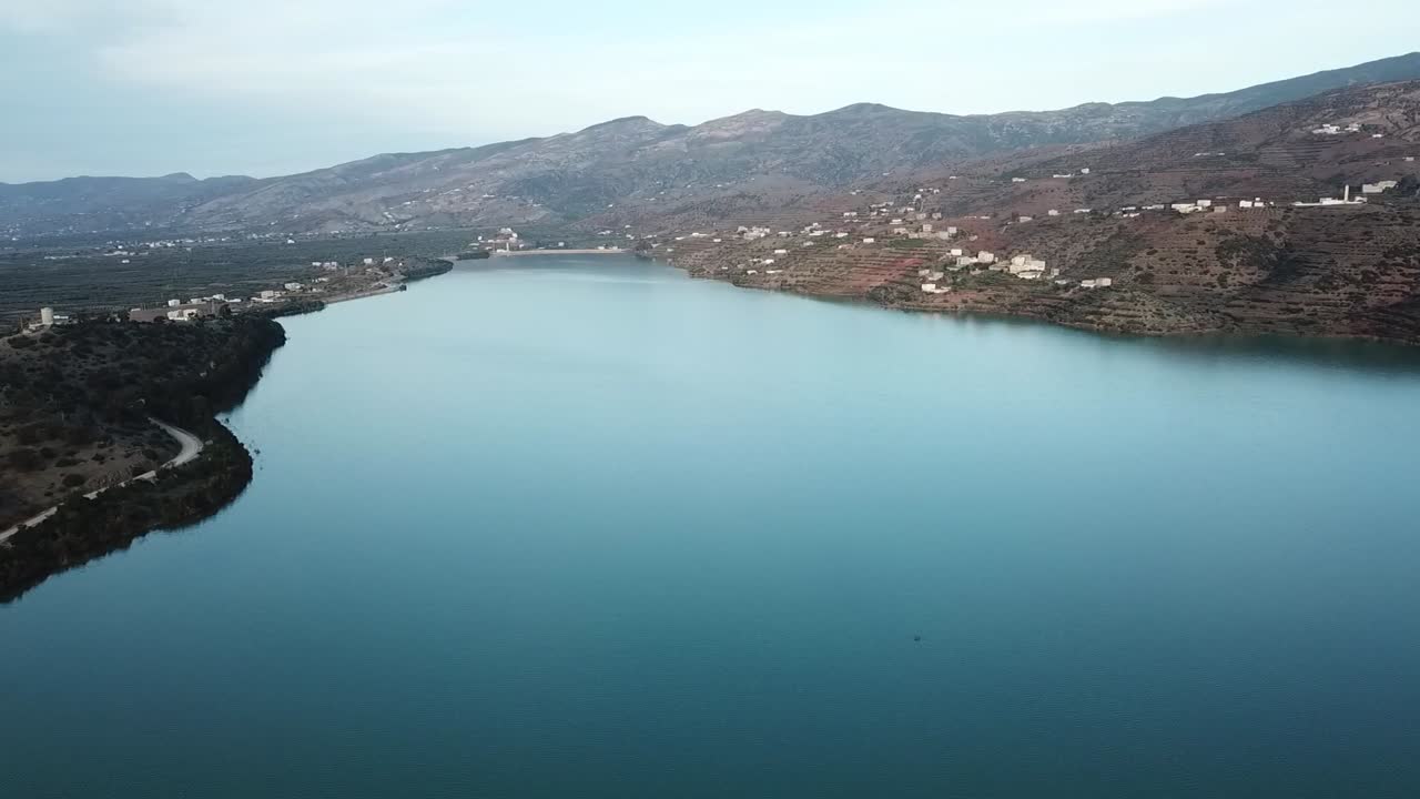 Breathtaking aerial view of a secluded sea cove embraced by the rugged slopes of the Rif Mountains. A hidden coastal gem in Northern Morocco