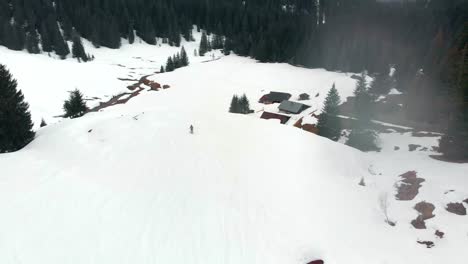 Drone-follow-shot-skiing-down-a-mountain