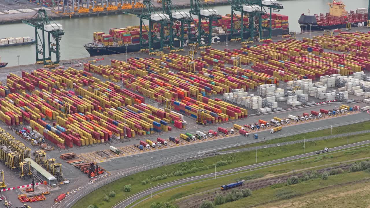 Drone view of industrial container harbor with shipping infrastructure