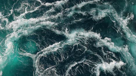 blue waves of water of the river and the sea meet each other during high tide and low tide.