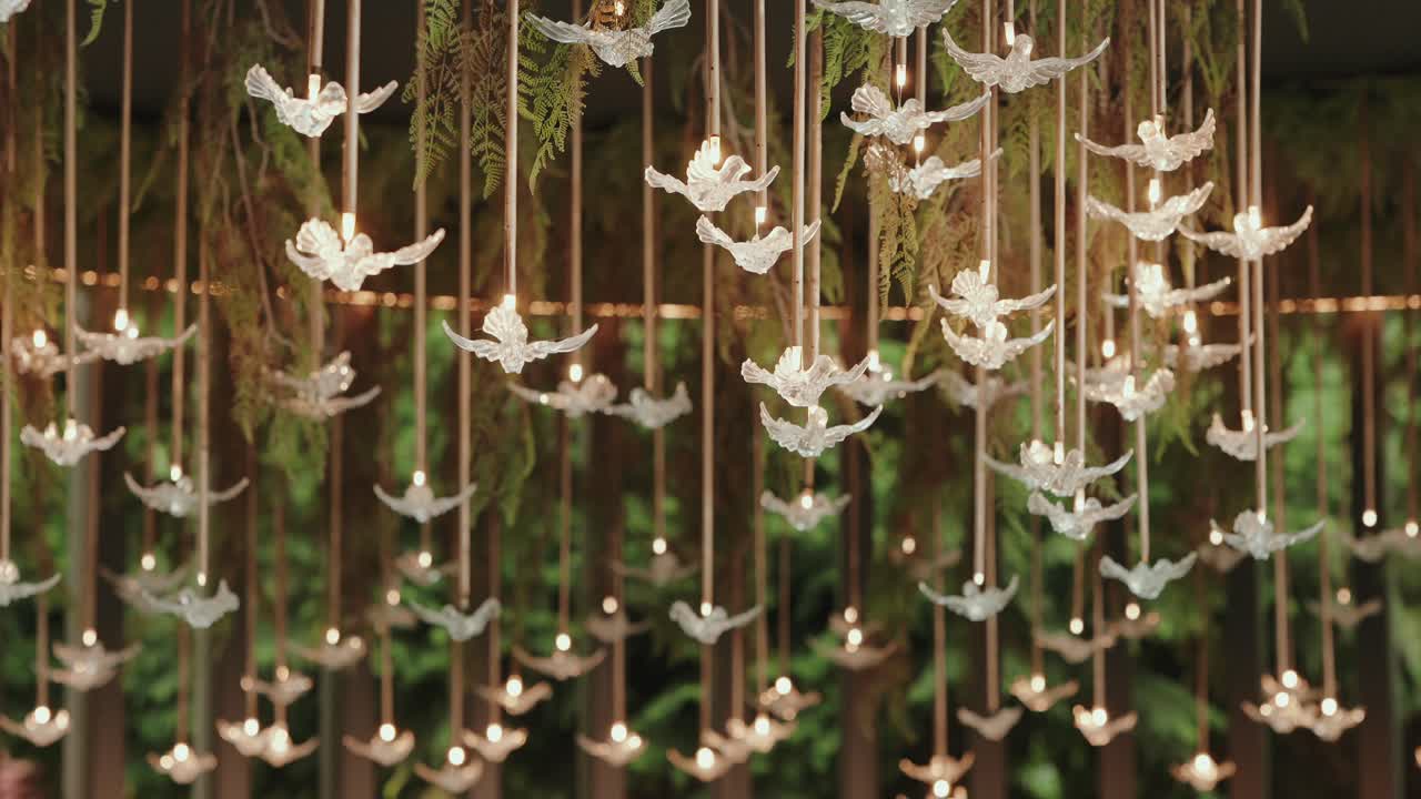 Magical hanging bird decor glows with ethereal elegance