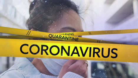 animation of coronavirus text on hazard tape over woman in face mask coughing in street